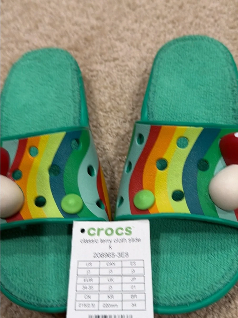 CROCS Kids Teal Slide Sandals with Rainbow Stripes